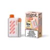 VOZOL Vista 40000 strawberry mango disposable vape device beside its pink striped packaging box, ready for use/retail display.