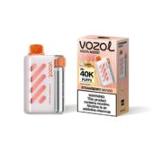 VOZOL Vista 40000 strawberry mango disposable vape device beside its pink striped packaging box, ready for use/retail display.