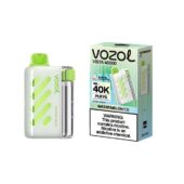 Vozol Vista 40000 watermelon ice disposable vape device with white body and lime green accents beside its box showing the product name.